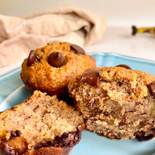 healthy banana bread dark chocolate chunk muffins on a blue plate ready to eat