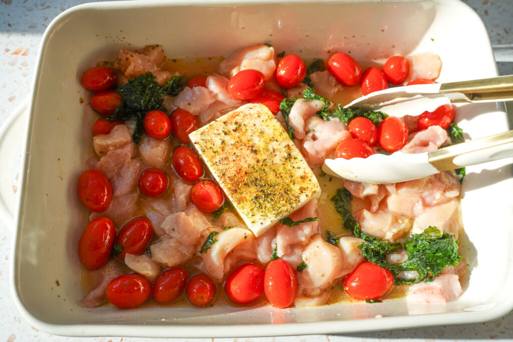ingredients for chicken tortellini bake in a white casserole dish